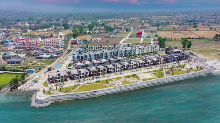 Emerald Riviera Haridwar society aerial view showing luxury flats along with Ganga River flowing in front